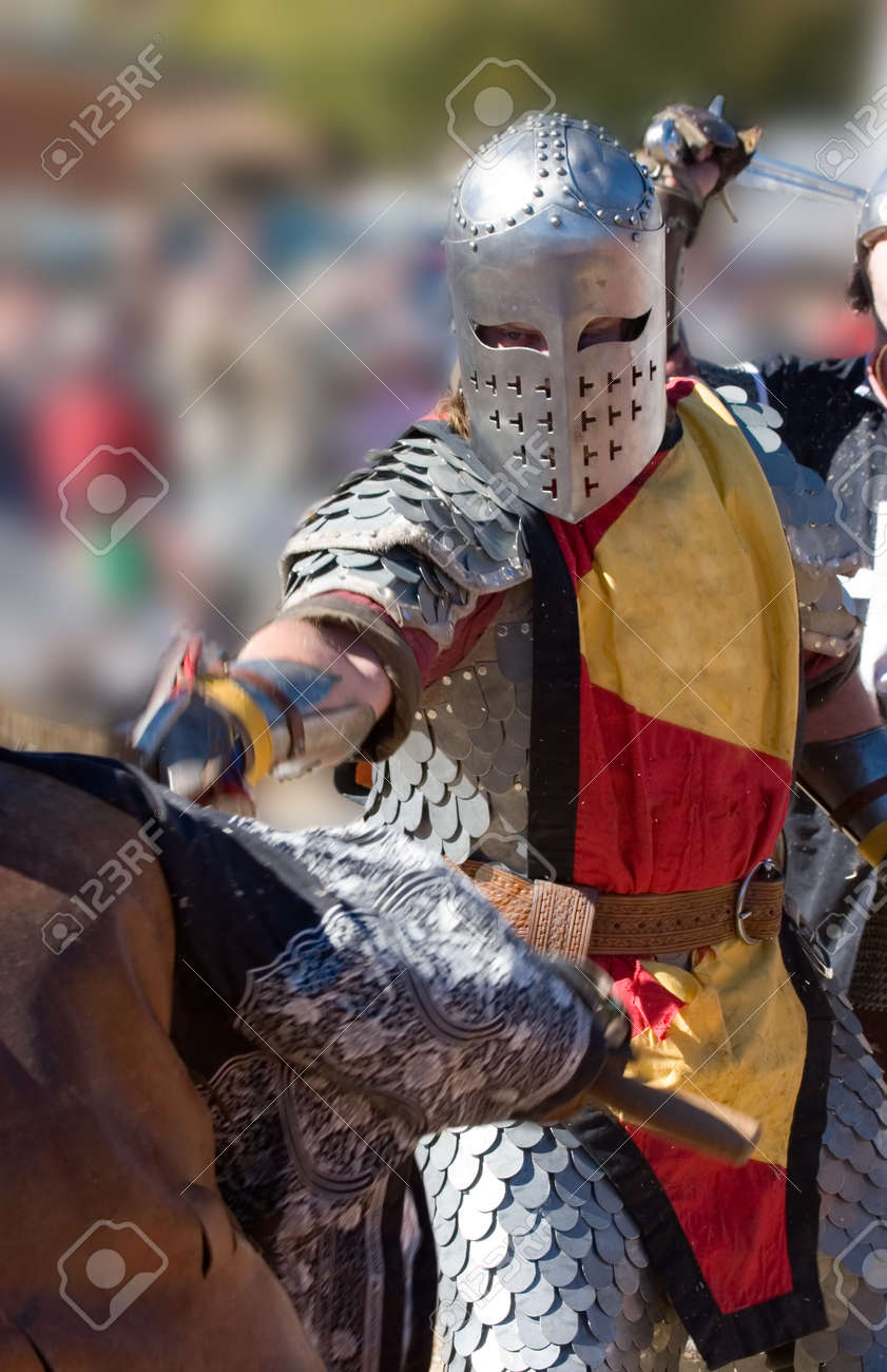 Warrior lunging with his sword, while behind him he is about to be struck - 167412327 Warrior lunging with his sword, while behind him he is about to be struck - 167412327