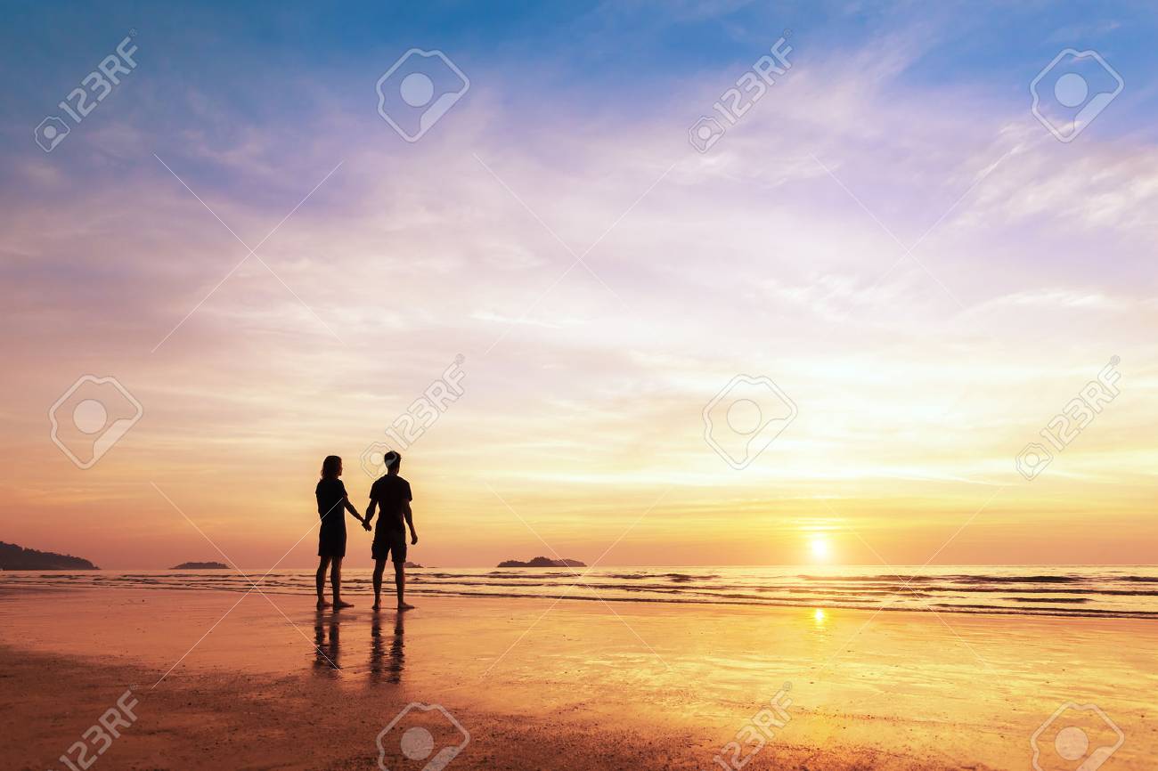Two Lovers Standing Together On A Tropical Beach And Thinking About Life,  Beautiful Sunset In The Background Stock Photo, Picture and Royalty Free  Image. Image 70839614., image size:1300x866