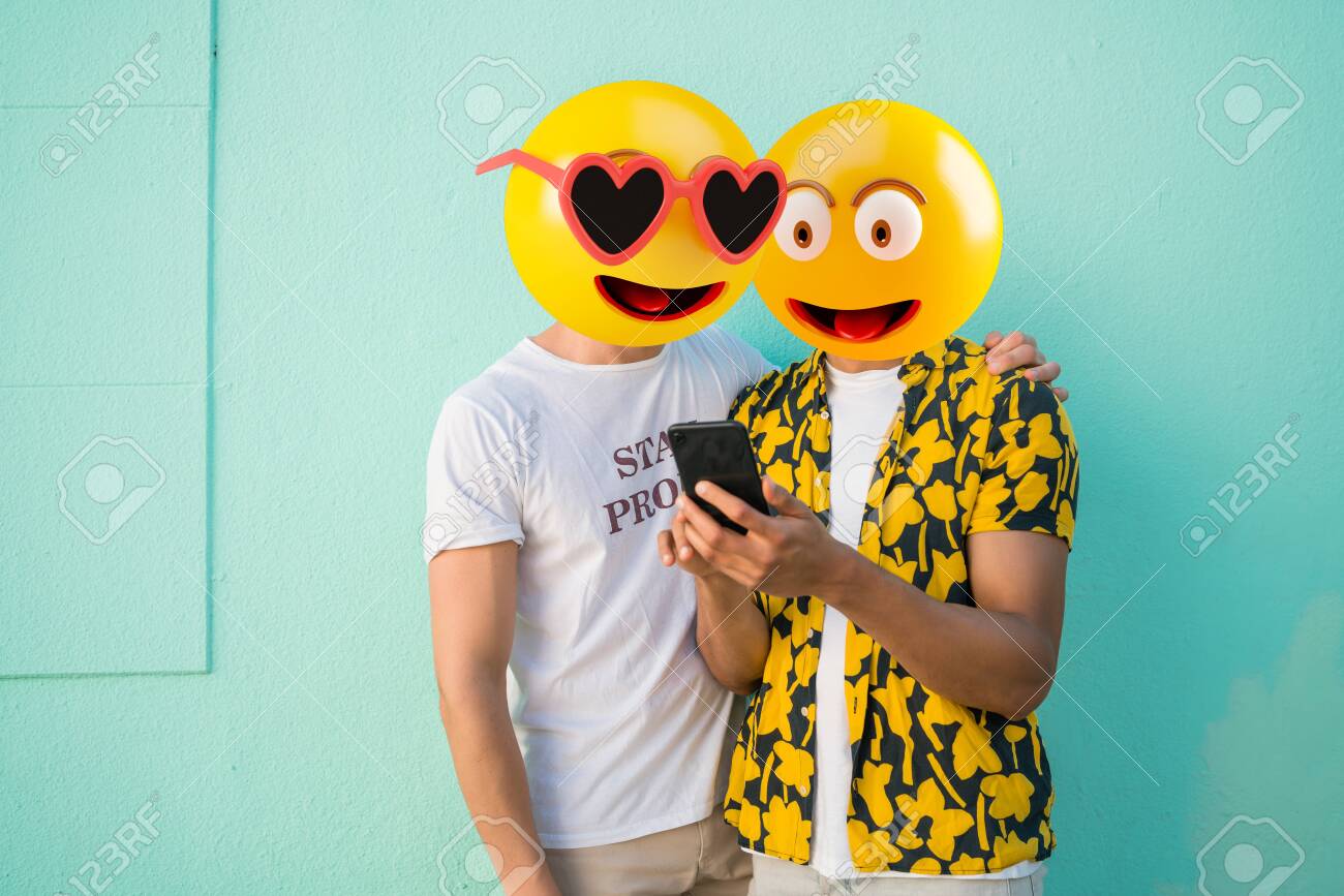 Emoji head man using a smartphone. Emoji concept - 141283246 Emoji head man using a smartphone. Emoji concept - 141283246
