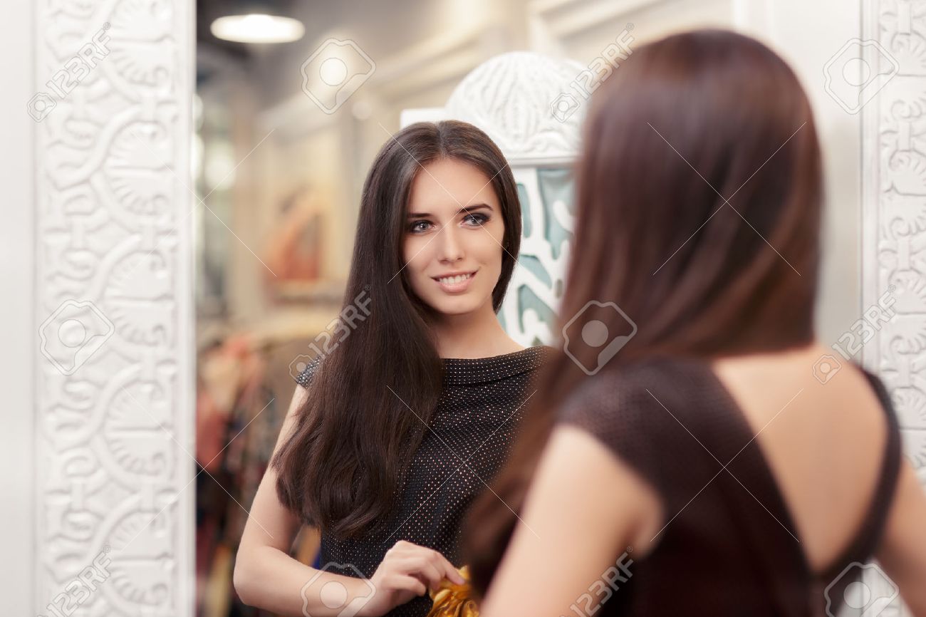 Beautiful Girl Looking In The Mirror And Trying On An Elegant Dress Stock Photo Picture And Royalty Free Image Image Beautiful Girl Looking In The Mirror And Trying On An Elegant Dress Stock Photo Picture And Royalty Free Image Image