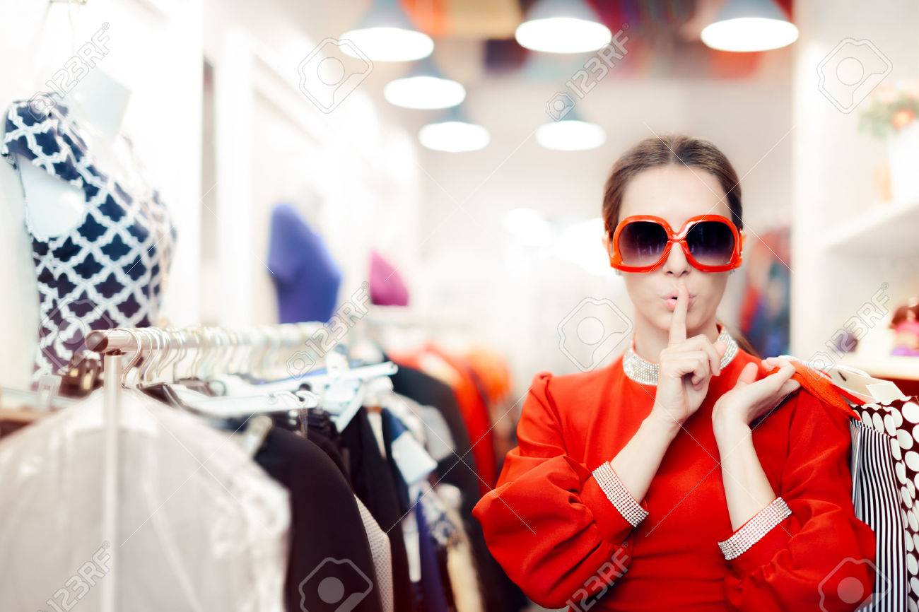 Shopping with Big Sunglasses Woman Keeping a Secret - 64861998 Shopping with Big Sunglasses Woman Keeping a Secret - 64861998