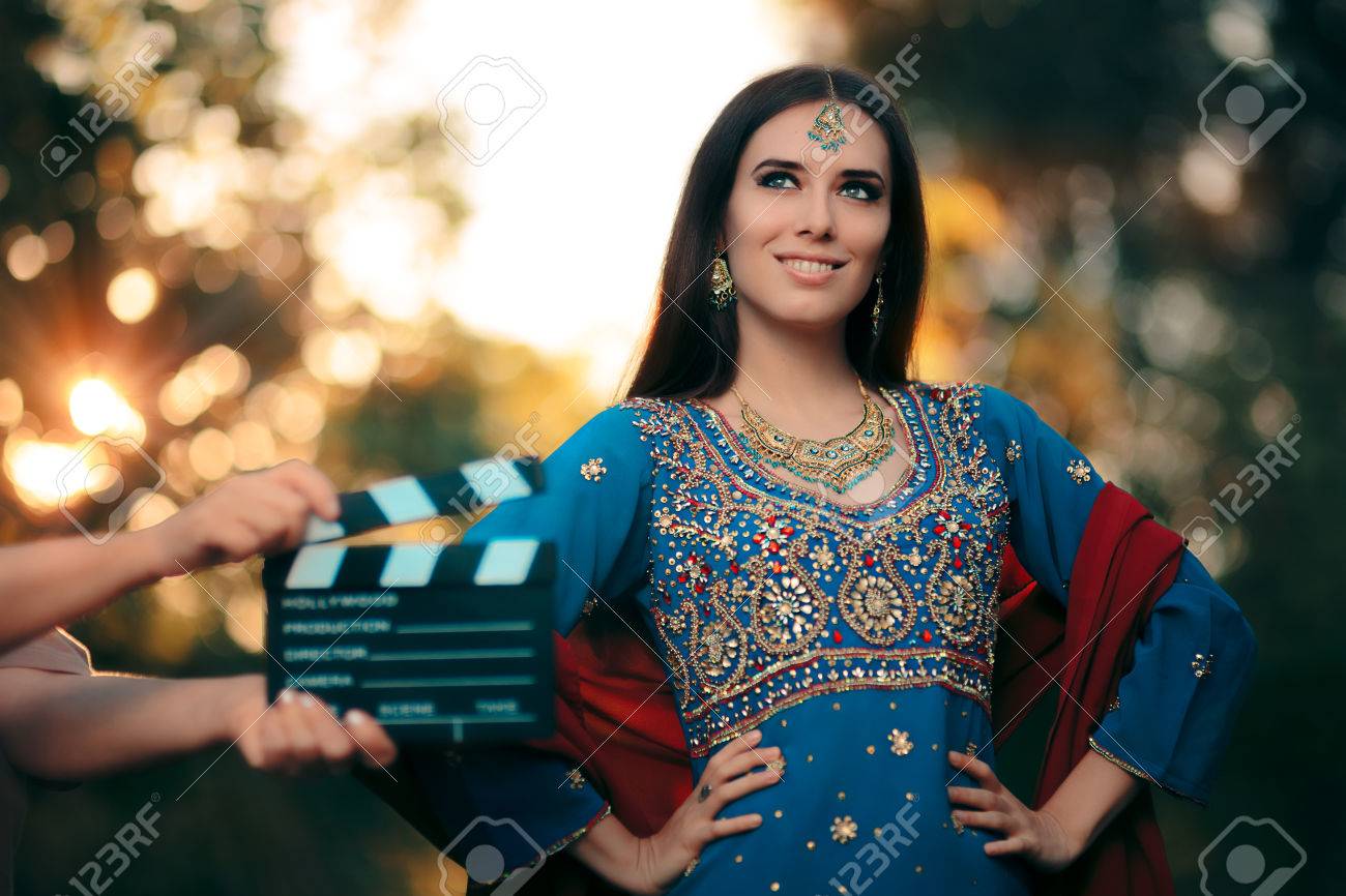 Bollywood Actress Wearing an Indian Outfit with Gold Jewelry Set - 79381782 Bollywood Actress Wearing an Indian Outfit with Gold Jewelry Set - 79381782