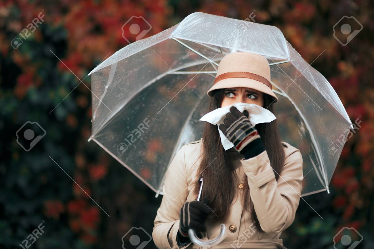Sick Woman Holding Umbrella in Autumn Rain Blowing Her Nose - 85410035 Sick Woman Holding Umbrella in Autumn Rain Blowing Her Nose - 85410035