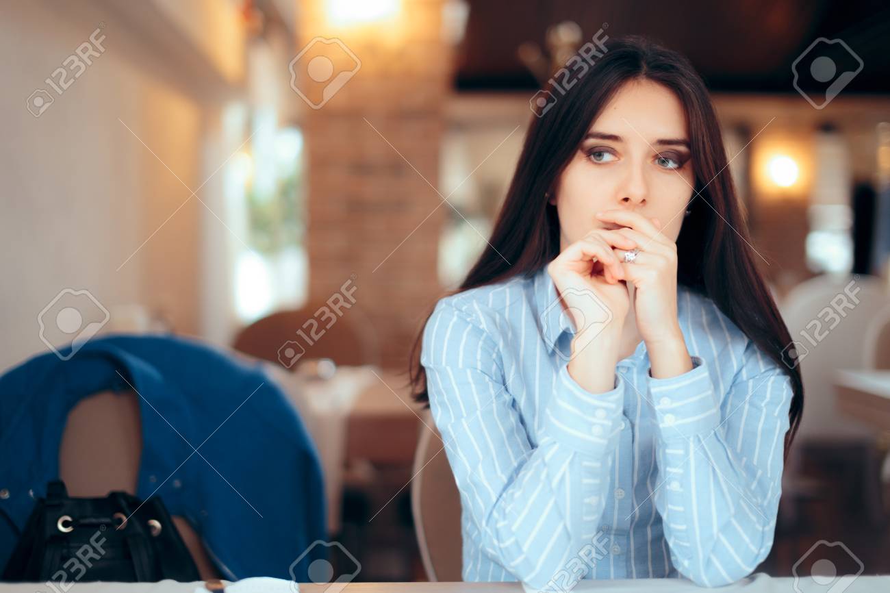 Sad Woman Removing Wedding Ring Thinking about Divorce - 107324559 Sad Woman Removing Wedding Ring Thinking about Divorce - 107324559