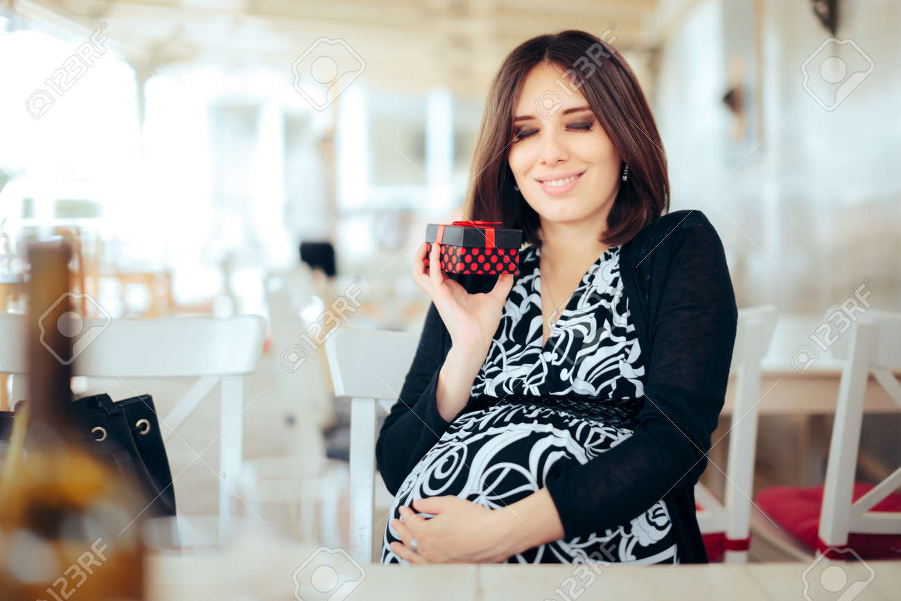 Cheerful Mother to be Receiving a Baby Shower Gift - 171415168 Cheerful Mother to be Receiving a Baby Shower Gift - 171415168
