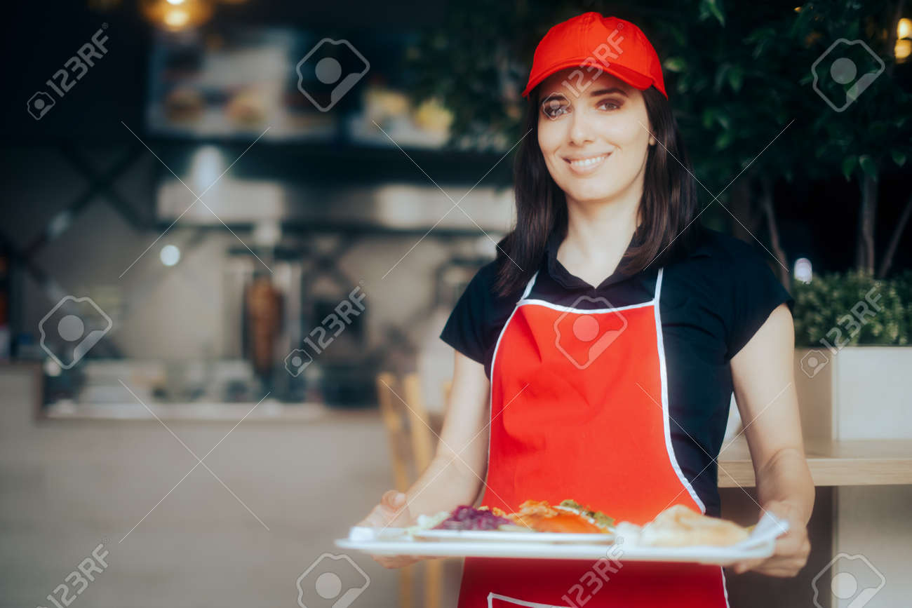 Happy Waitress Holding Food Tray Working in a Restaurant - 171551747 Happy Waitress Holding Food Tray Working in a Restaurant - 171551747