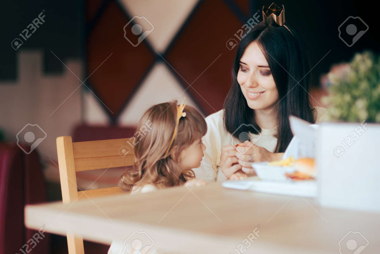 Mother and Daughter Celebrating at Fast Food Birthday Party - 171586502 Mother and Daughter Celebrating at Fast Food Birthday Party - 171586502