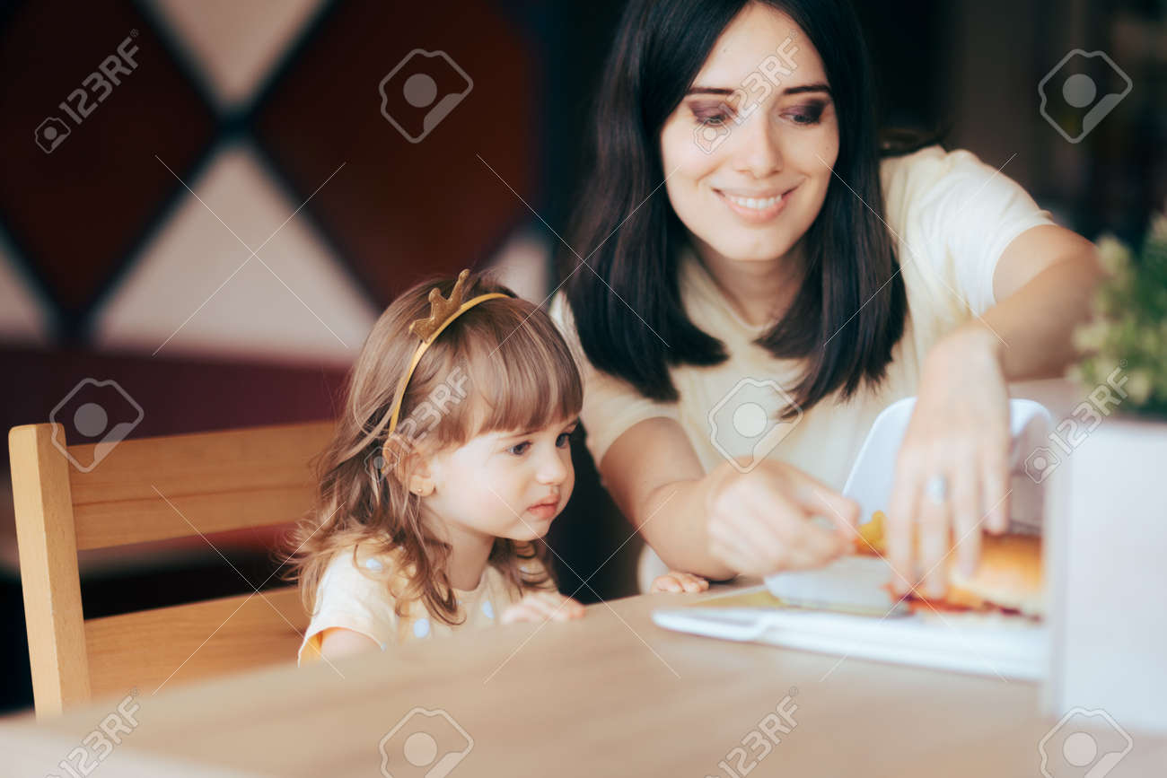 Mother and Daughter Celebrating at Fast Food Birthday Party - 171586503 Mother and Daughter Celebrating at Fast Food Birthday Party - 171586503