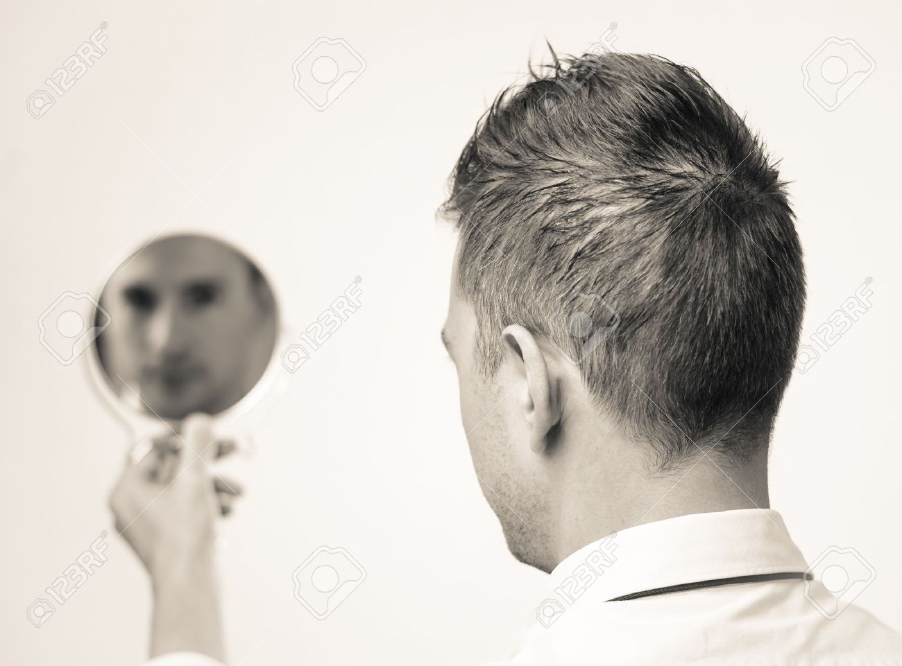 ego business man looking in the mirror and reflecting stock photo