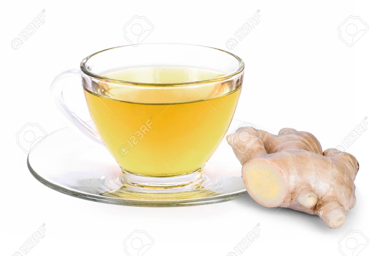 Closeup hot ginger tea in glass cup with fresh organic ginger root isolated on white background . - 152662286 Closeup hot ginger tea in glass cup with fresh organic ginger root isolated on white background . - 152662286