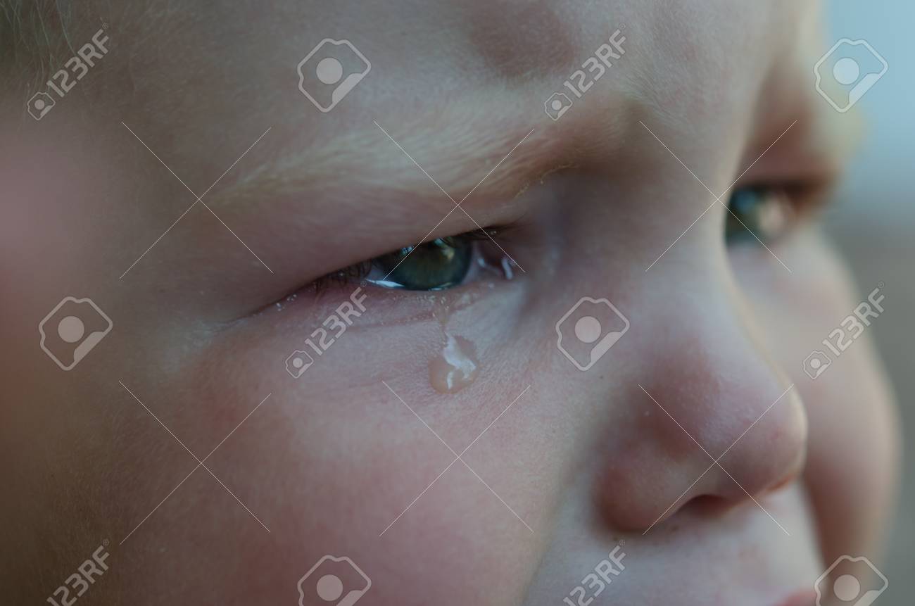 Little Baby Is Crying Tears In Her Eyes Close Up Stock Photo