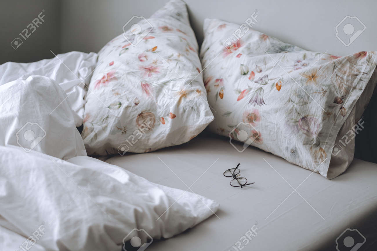 Bed With A White Blanket And Pillows In The Morning. Home Comfort.  Фотография, картинки, изображения и сток-фотография без роялти. Image  153855873