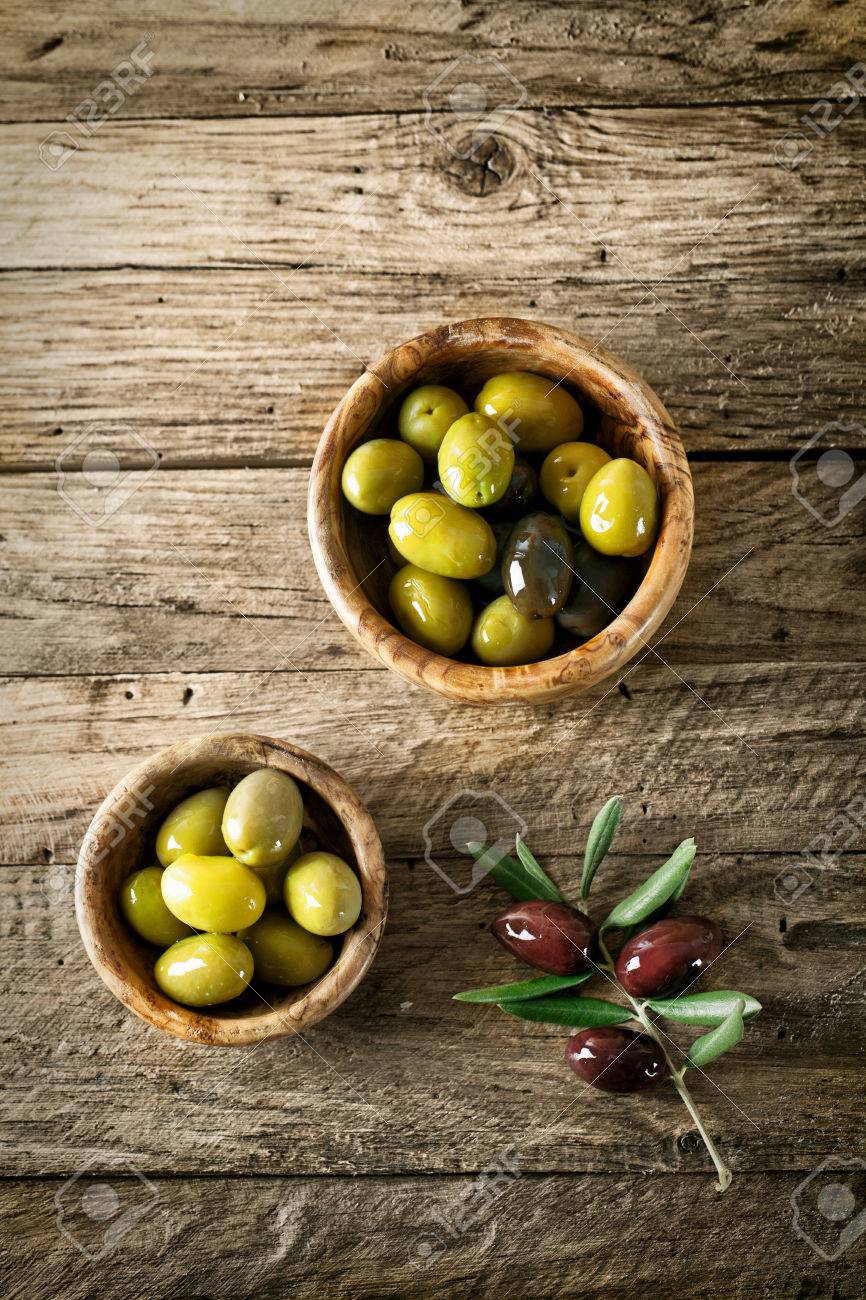 olives on old wood. Wooden table with olives and olive oil - 42140219 olives on old wood. Wooden table with olives and olive oil - 42140219
