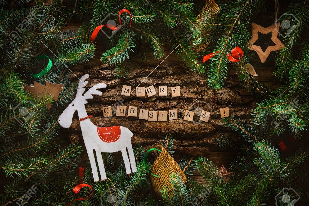 Merry Christmas. Christmas greeting card with rustic wood and ornaments. Xmas backgroud. - 48977452 Merry Christmas. Christmas greeting card with rustic wood and ornaments. Xmas backgroud. - 48977452