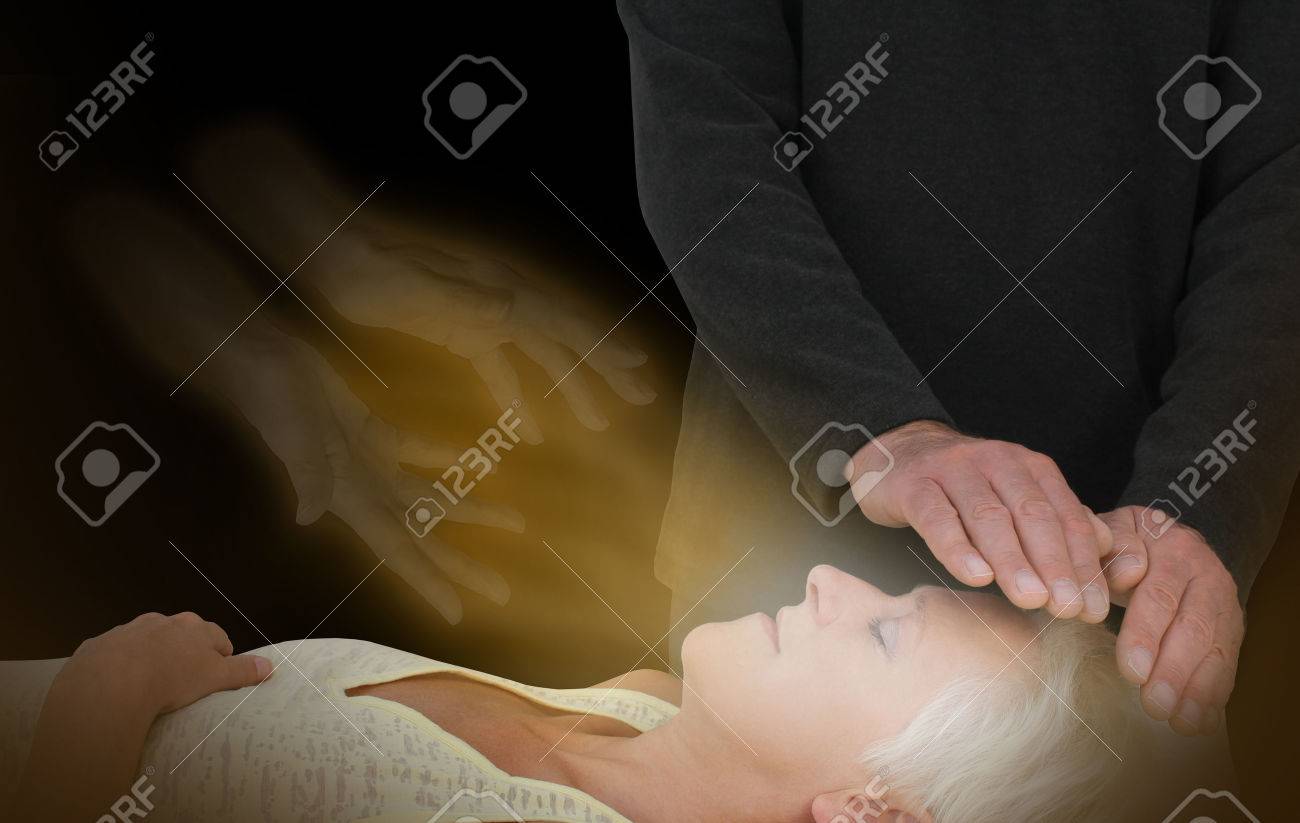 Spiritual Healing Session - male healer channeling healing energy to female with the help of a spirit healing guide - 54639695 Spiritual Healing Session - male healer channeling healing energy to female with the help of a spirit healing guide - 54639695