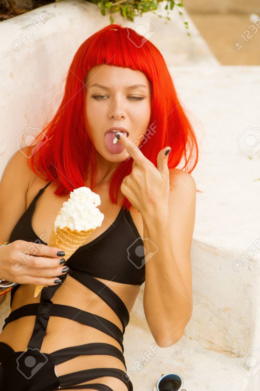 Close Up Of Sexy Lady In Red Wig And Black Sensual Swimsuit Lick Her Finger With Close Up Of Sexy Lady In Red Wig And Black Sensual Swimsuit Lick Her Finger With