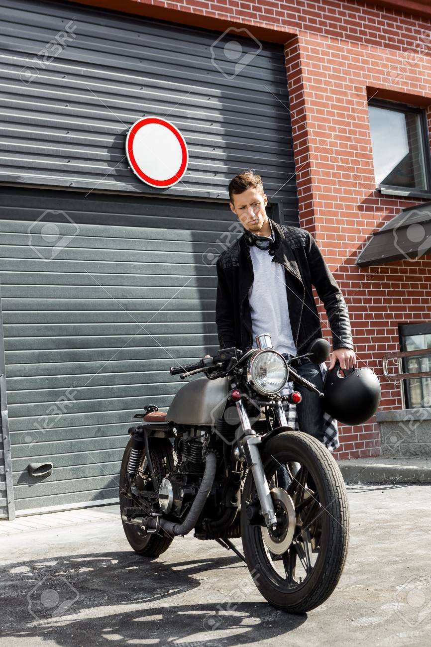 Handsome Young Rider Man In Black Biker Jacket And Jeans Go To Stock Photo Picture And Royalty Free Image Image 82495409