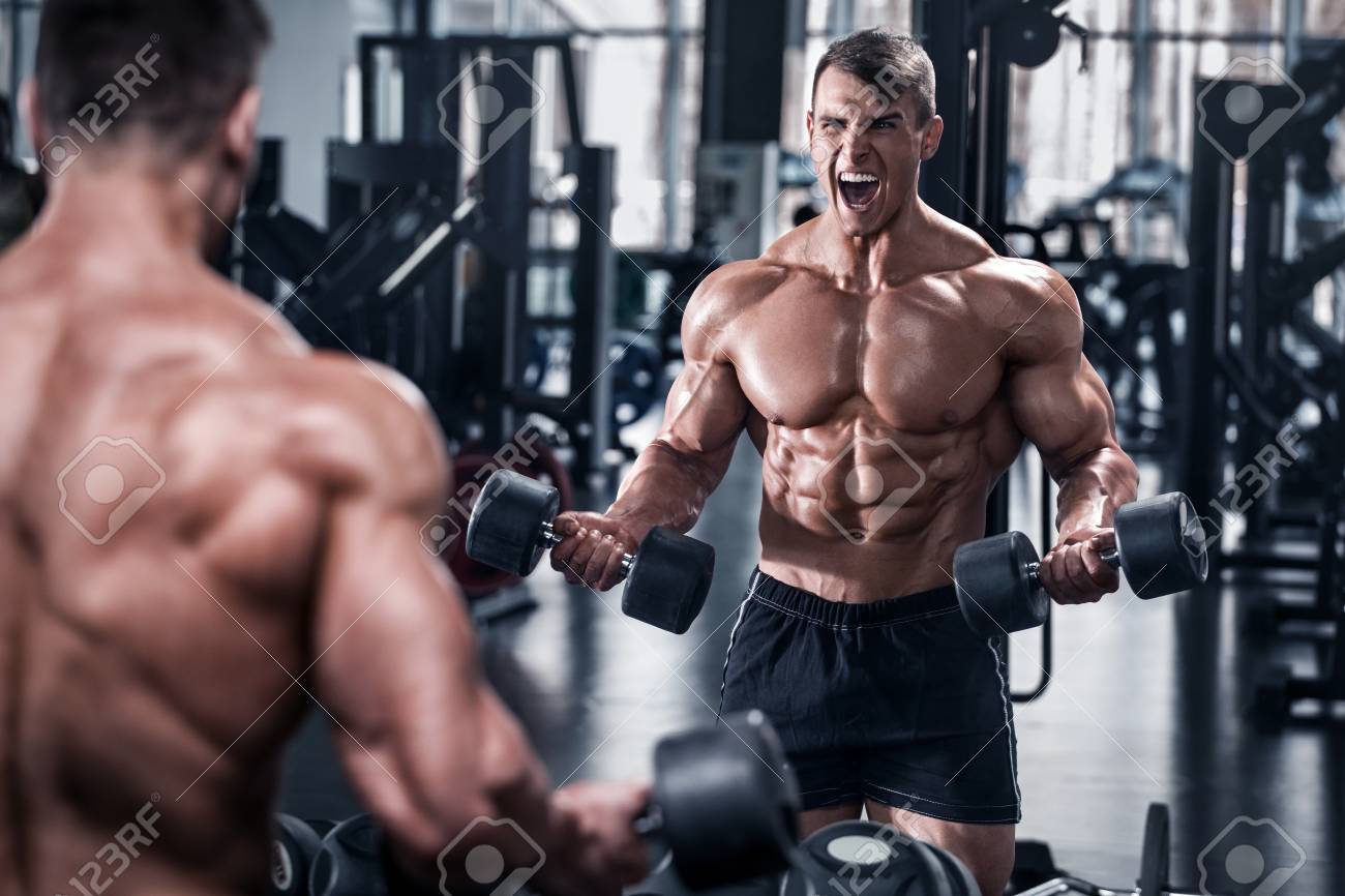 Muscular Man Working Out In Gym, Bodybuilder. Strong Male Abs Stock Photo, Picture And Royalty Free Image. Image 100408772.