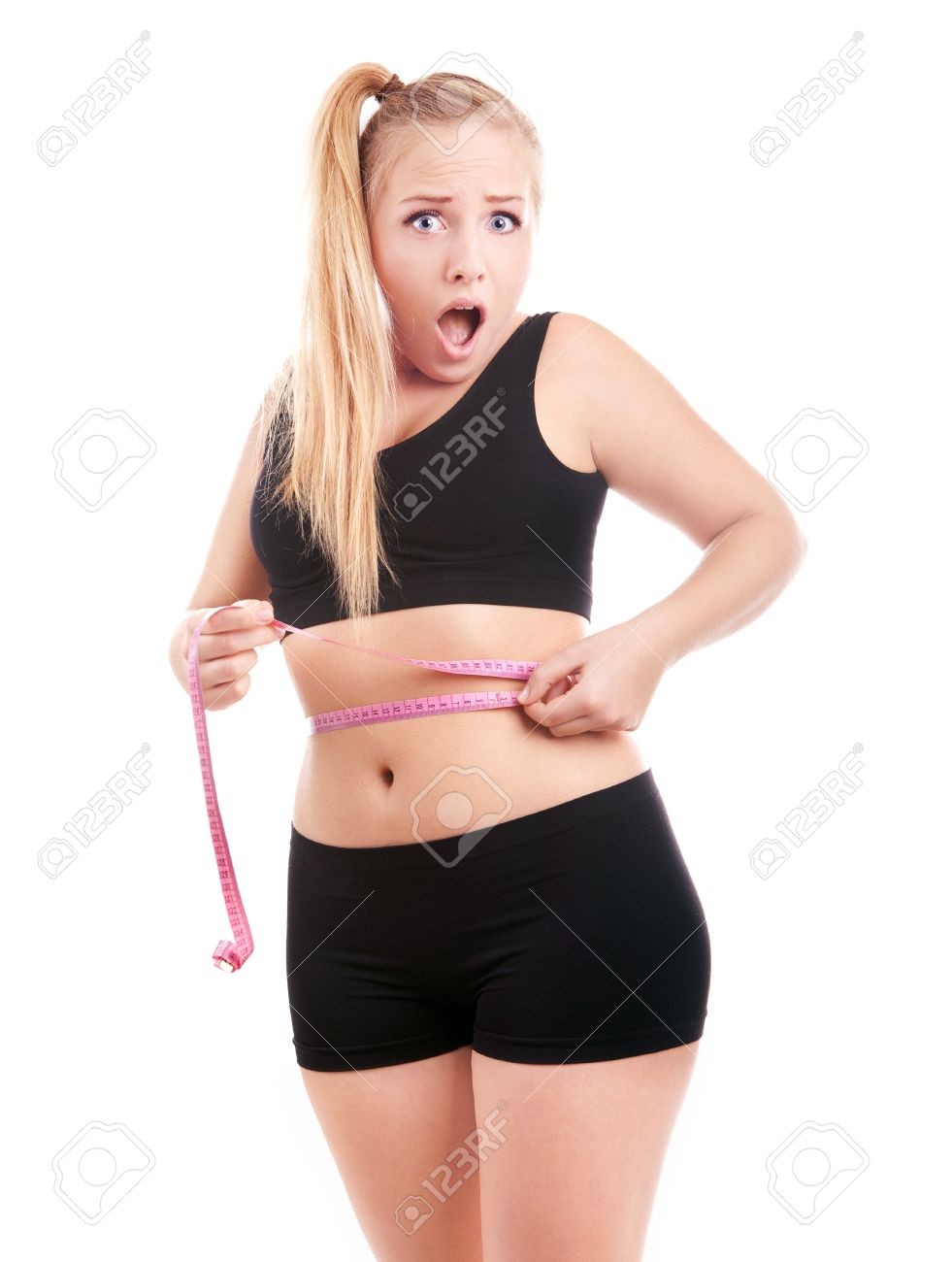 size 40 girl is shocked by measuring her waist stock photo picture size 40 woman