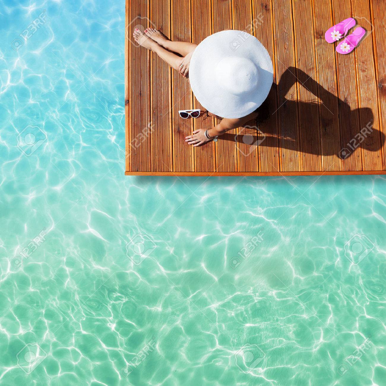 summer holiday fashion concept tanning woman wearing sun hat