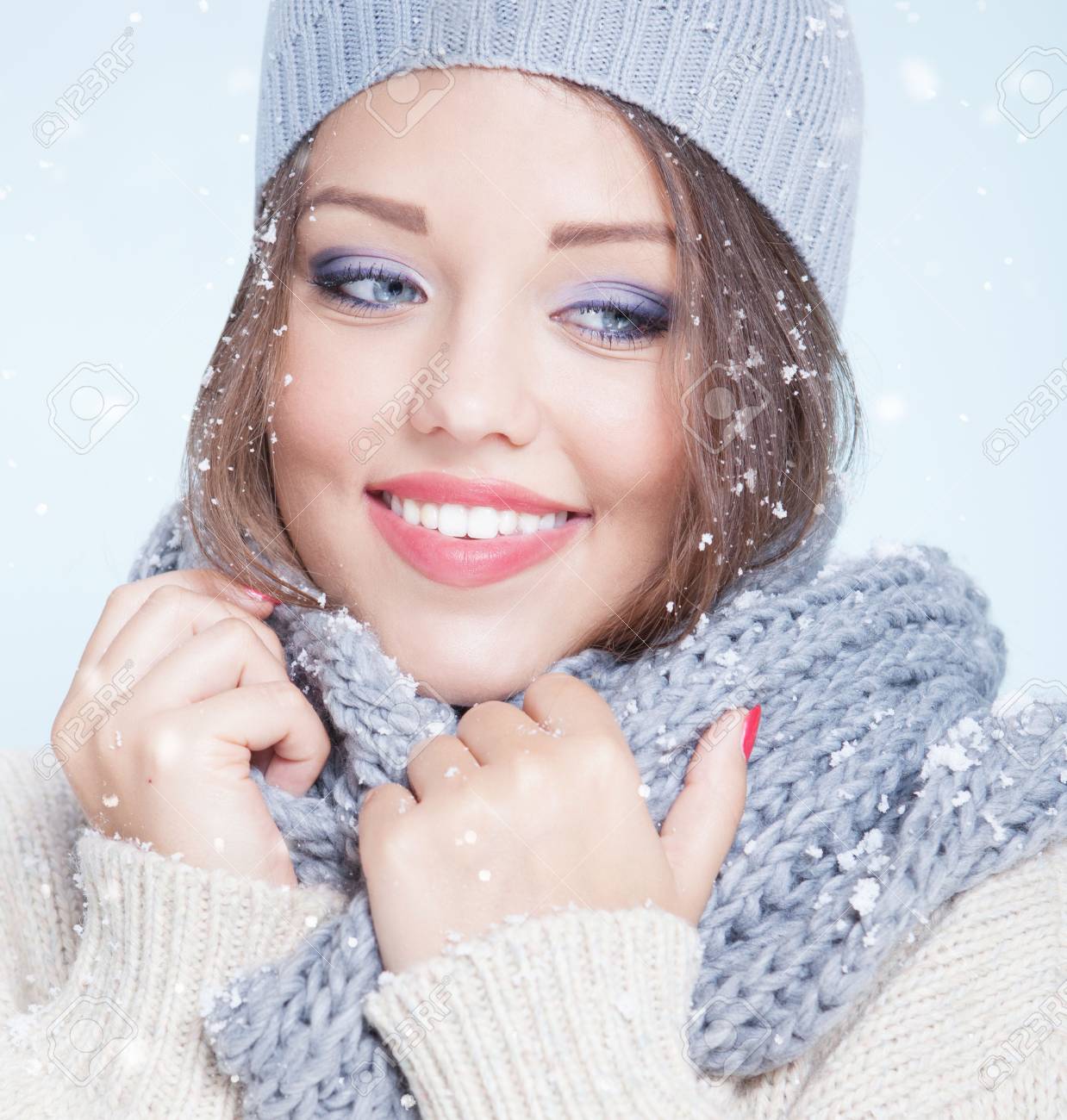 Winter face close up of young attractive happy smiling woman covered with snow flakes. Christmas concept. - 47610262 Winter face close up of young attractive happy smiling woman covered with snow flakes. Christmas concept. - 47610262