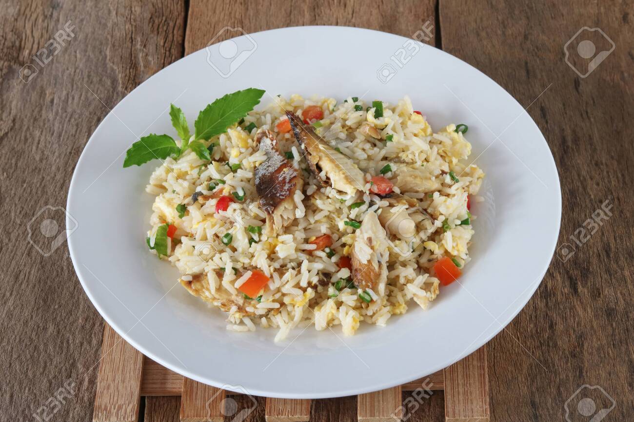 Fried rice with mackerel and egg on wood background - 155074778 Fried rice with mackerel and egg on wood background - 155074778