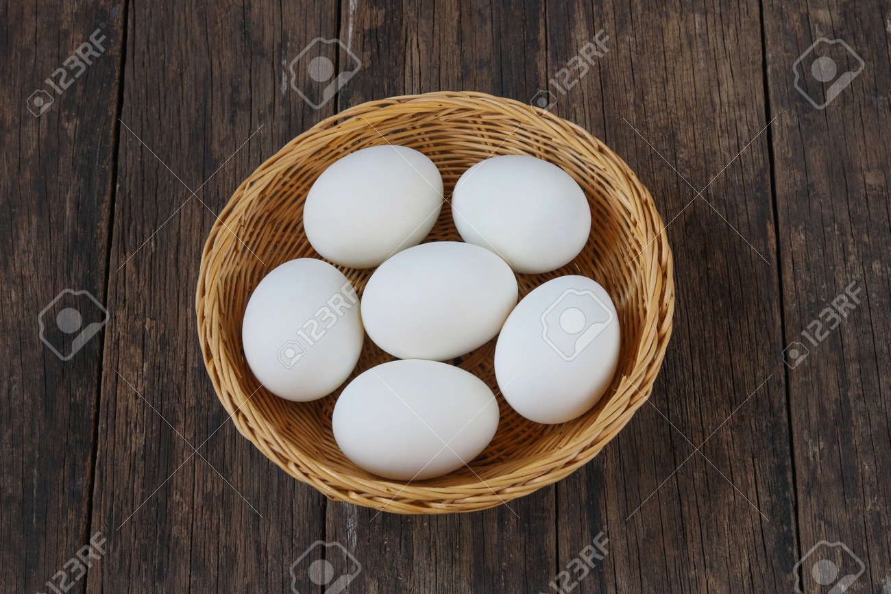 Salted duck eggs in basket on old wooden background. - 158834377 Salted duck eggs in basket on old wooden background. - 158834377