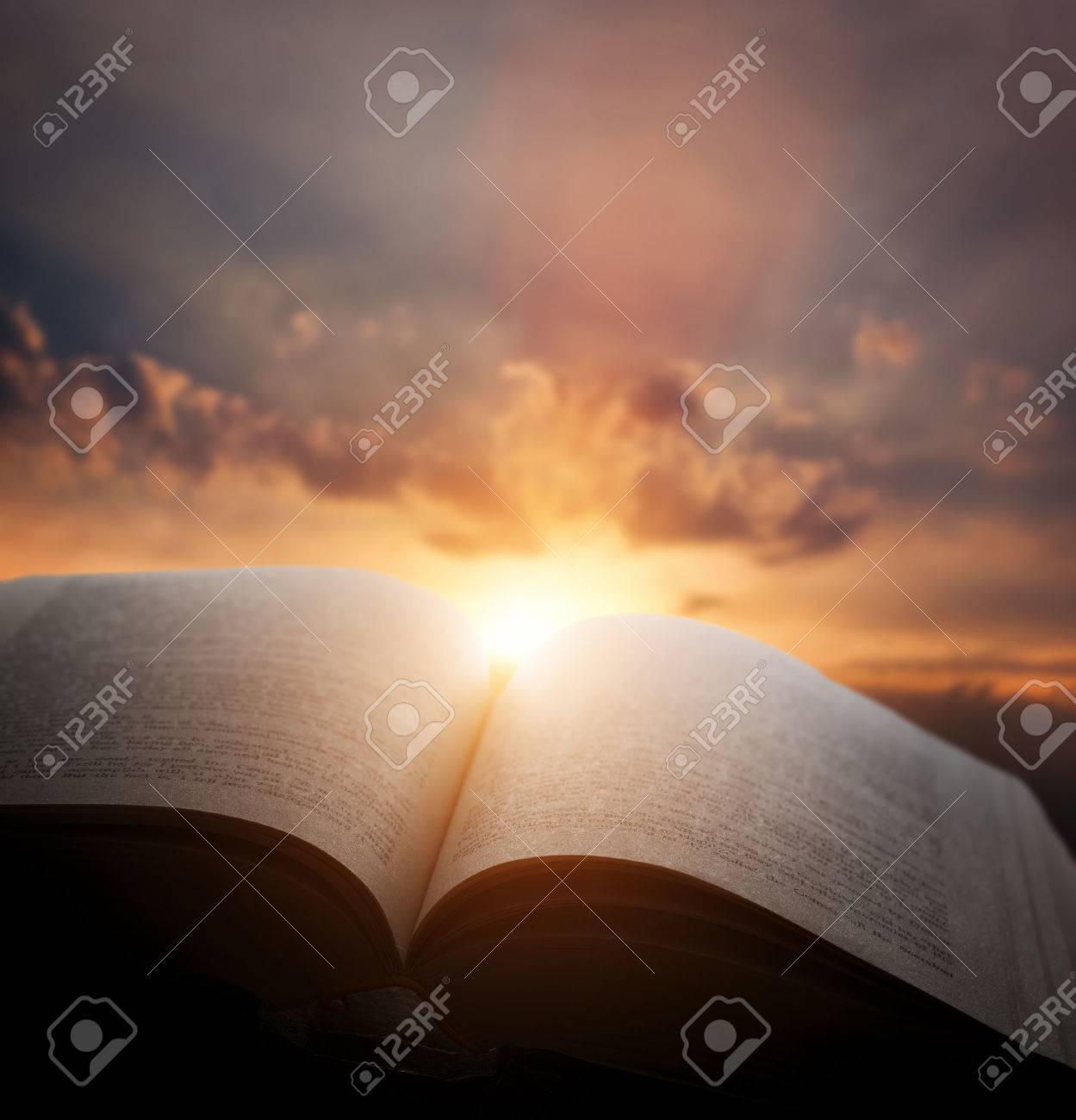 Open old book, light from the sunset sky, heaven. Fantasy, imagination, education, religion concept. - 44216753 Open old book, light from the sunset sky, heaven. Fantasy, imagination, education, religion concept. - 44216753