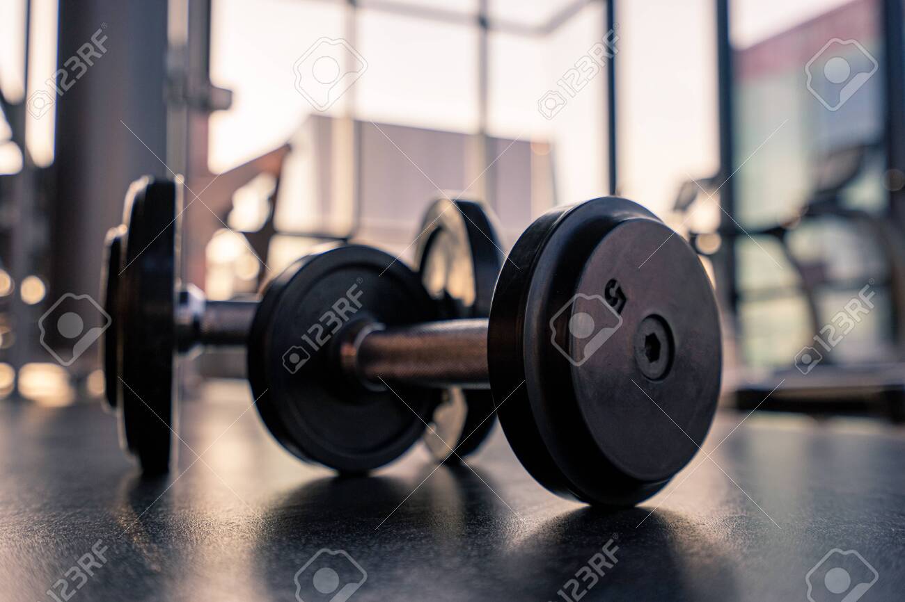 Dumbbell on the floor in luxury clubhouse wait for exercise in the morning - 130674205 Dumbbell on the floor in luxury clubhouse wait for exercise in the morning - 130674205