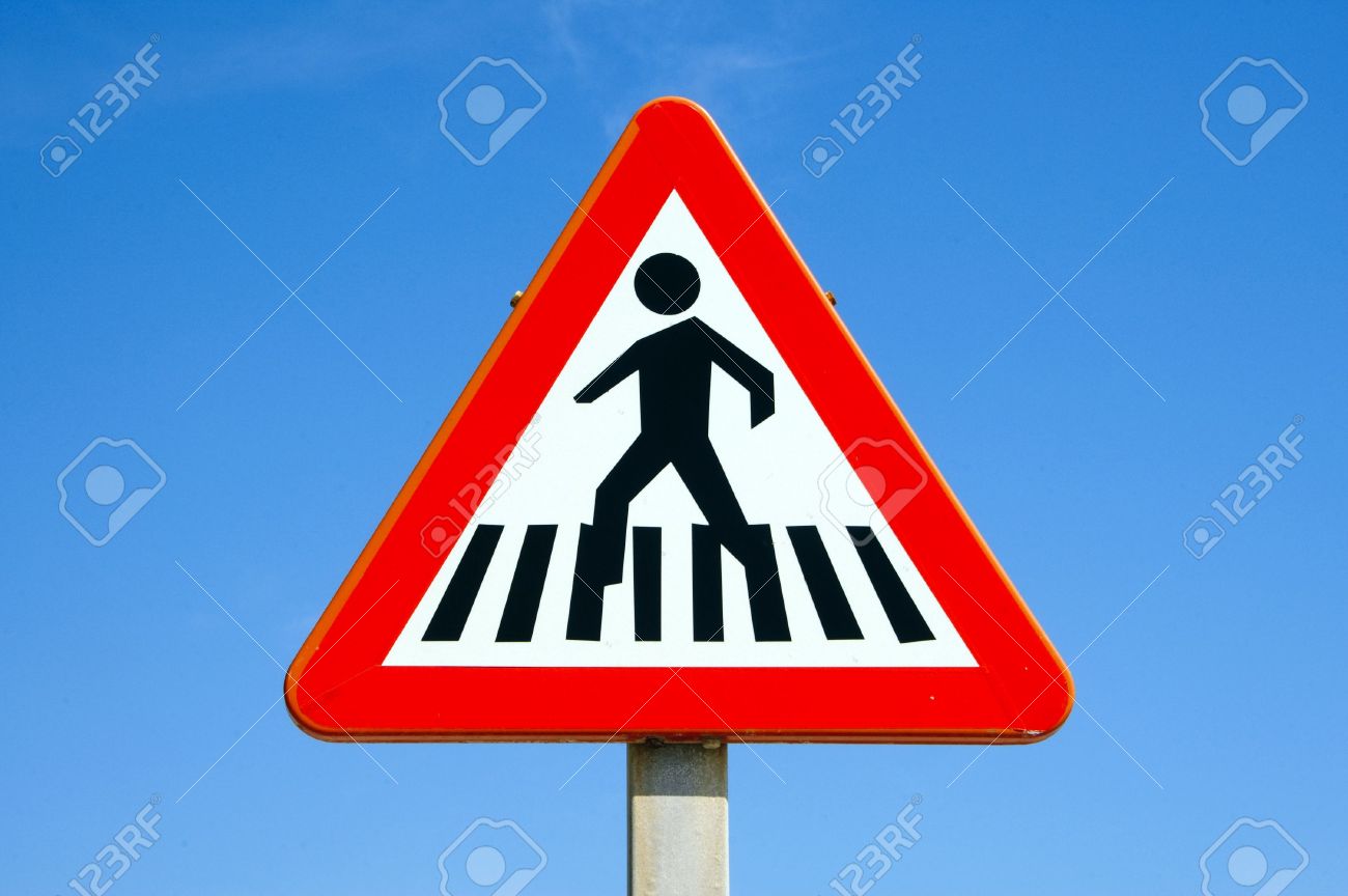 pedestrian crossing sign over the blue sky stock photo picture and