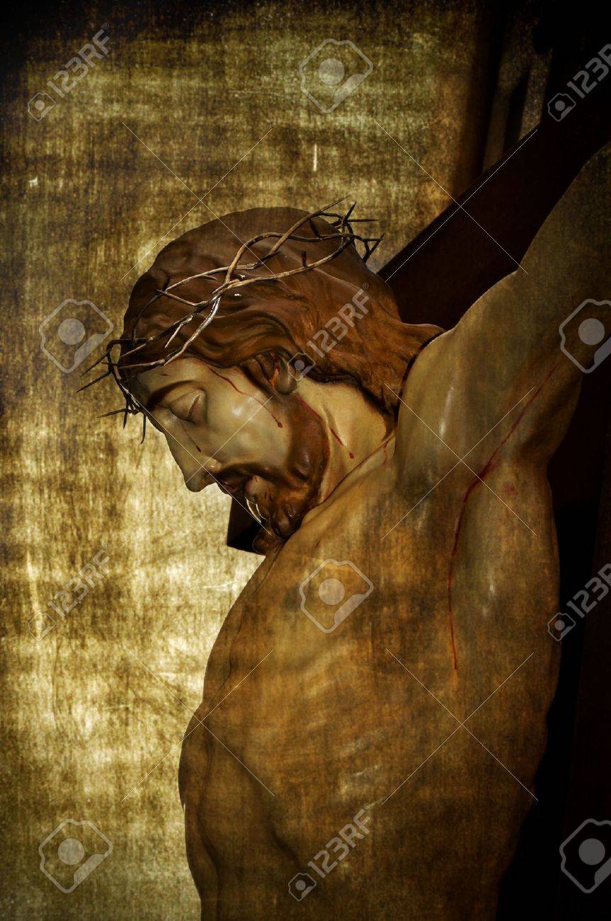Jesus Christ On The Holy Cross On A Vintage Background Stock Photo