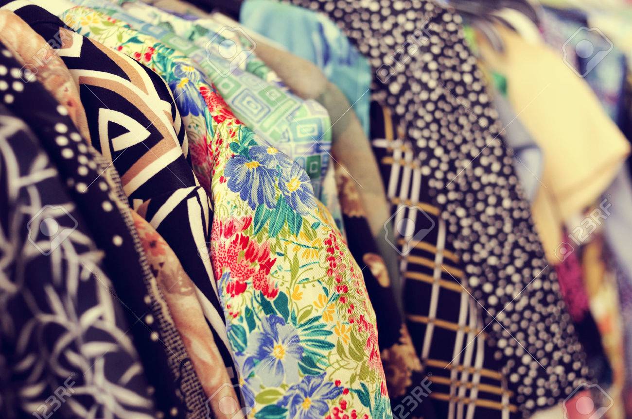 some used clothes hanging on a rack in a flea market - 36870213 some used clothes hanging on a rack in a flea market - 36870213