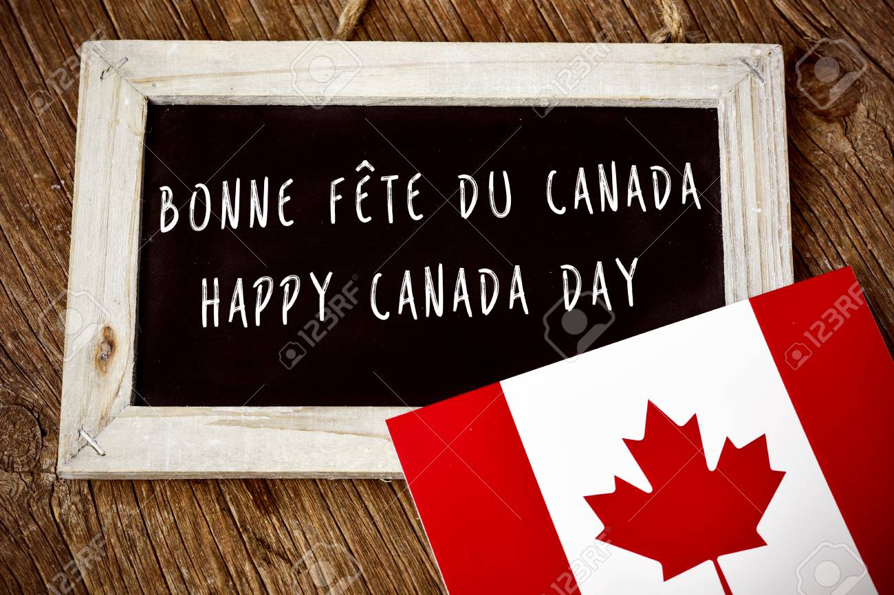 59452177-the-text-happy-canada-day-written-in-french-and-english-in-a-chalkboard-and-a-flag-of-canada-on-a-ru.jpg