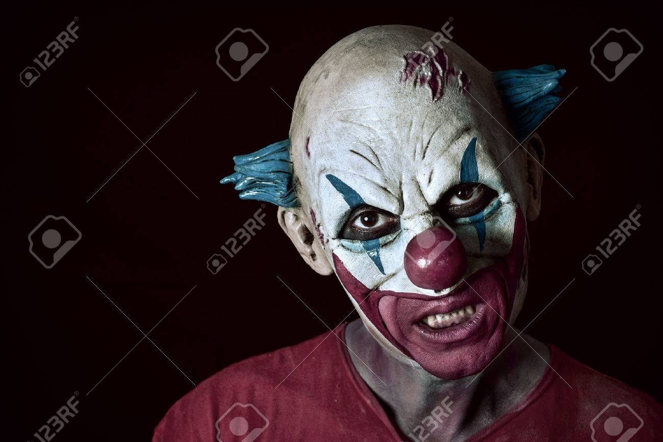 portrait of a scary evil clown against a dark background - 63769814 portrait of a scary evil clown against a dark background - 63769814