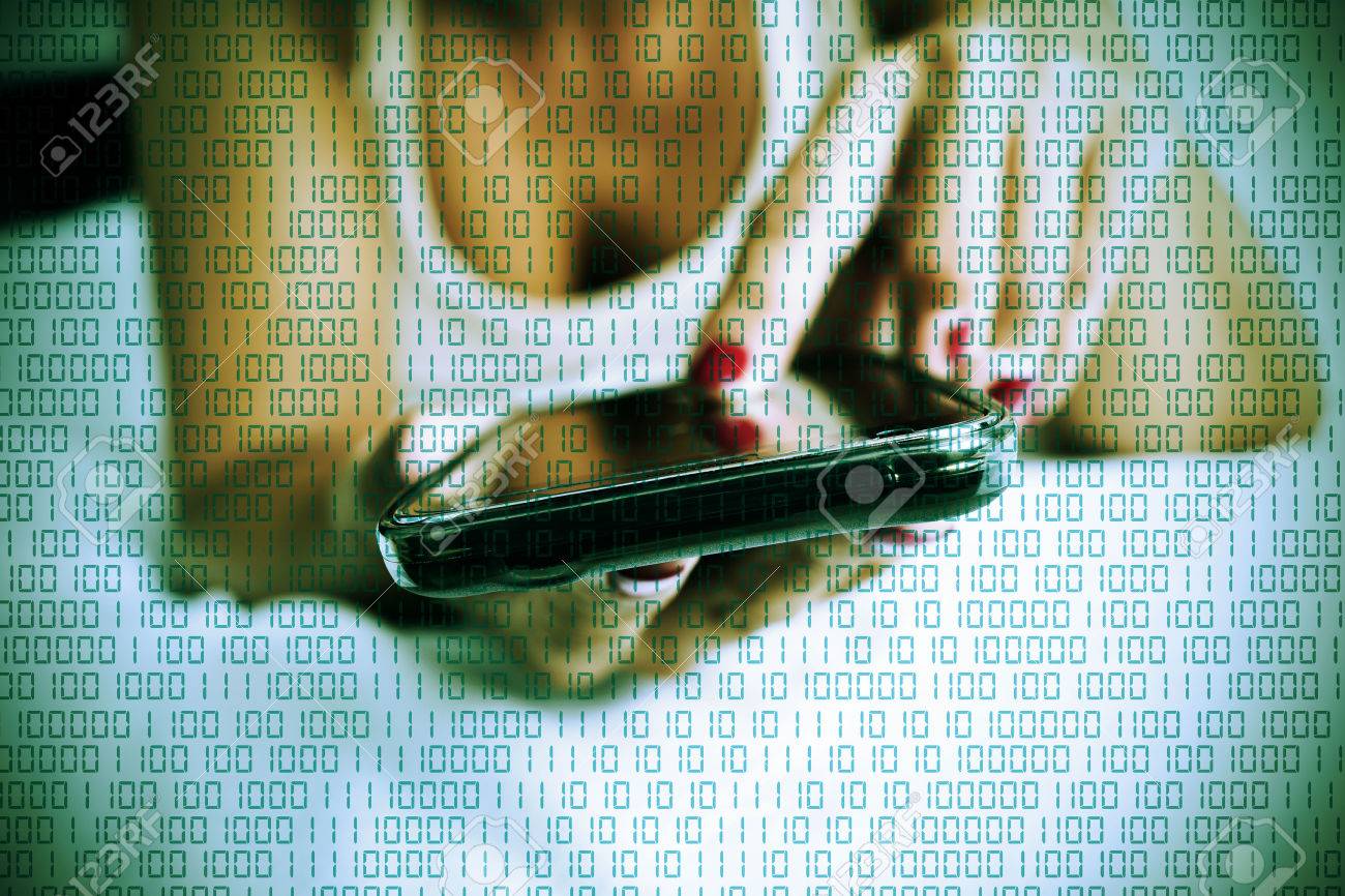 a young caucasian woman face down in bed using a smartphone and a succession of numbers one and zero for the binary code in the foreground - 65645894 a young caucasian woman face down in bed using a smartphone and a succession of numbers one and zero for the binary code in the foreground - 65645894