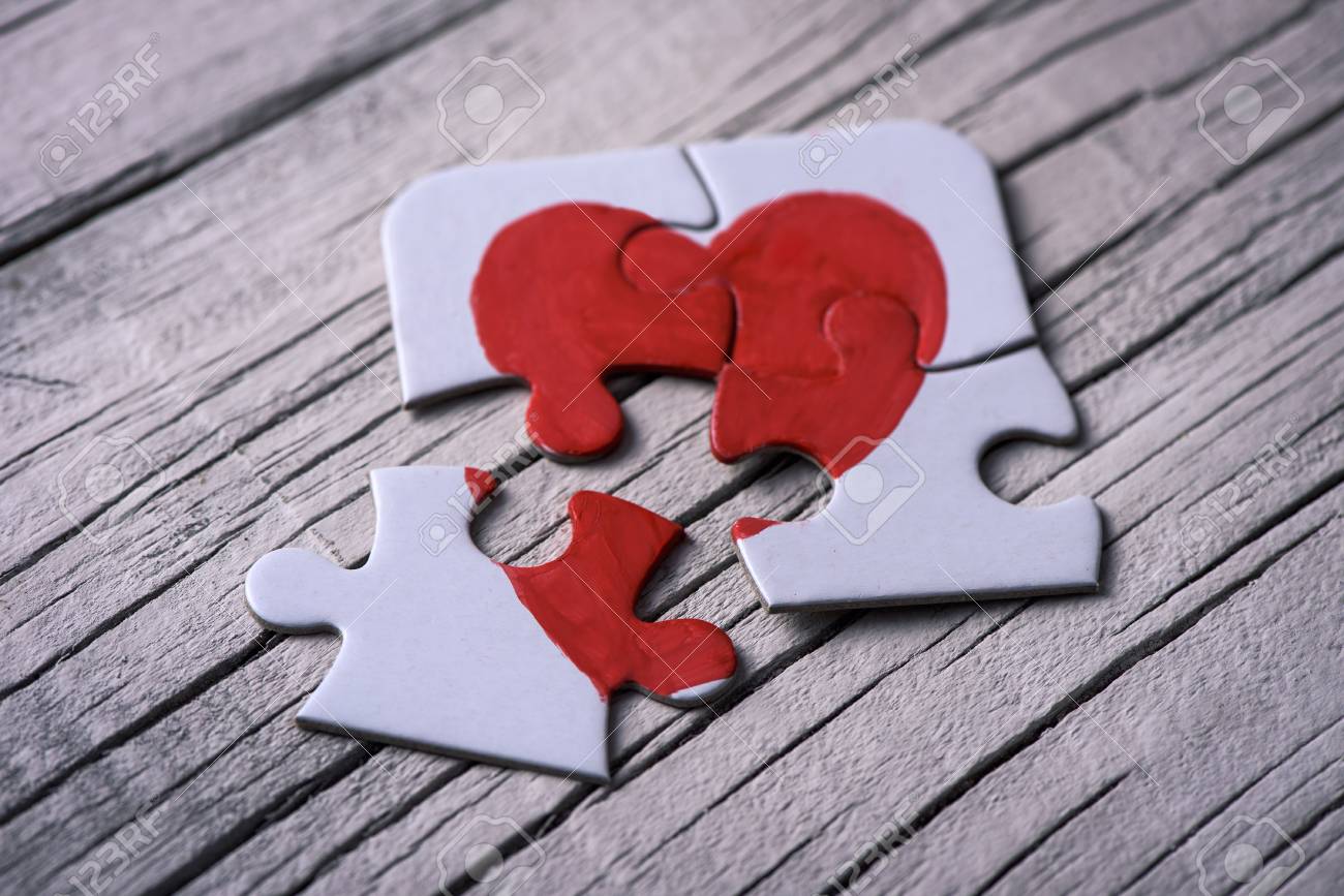closeup of some separated pieces of a puzzle which together form form 3454