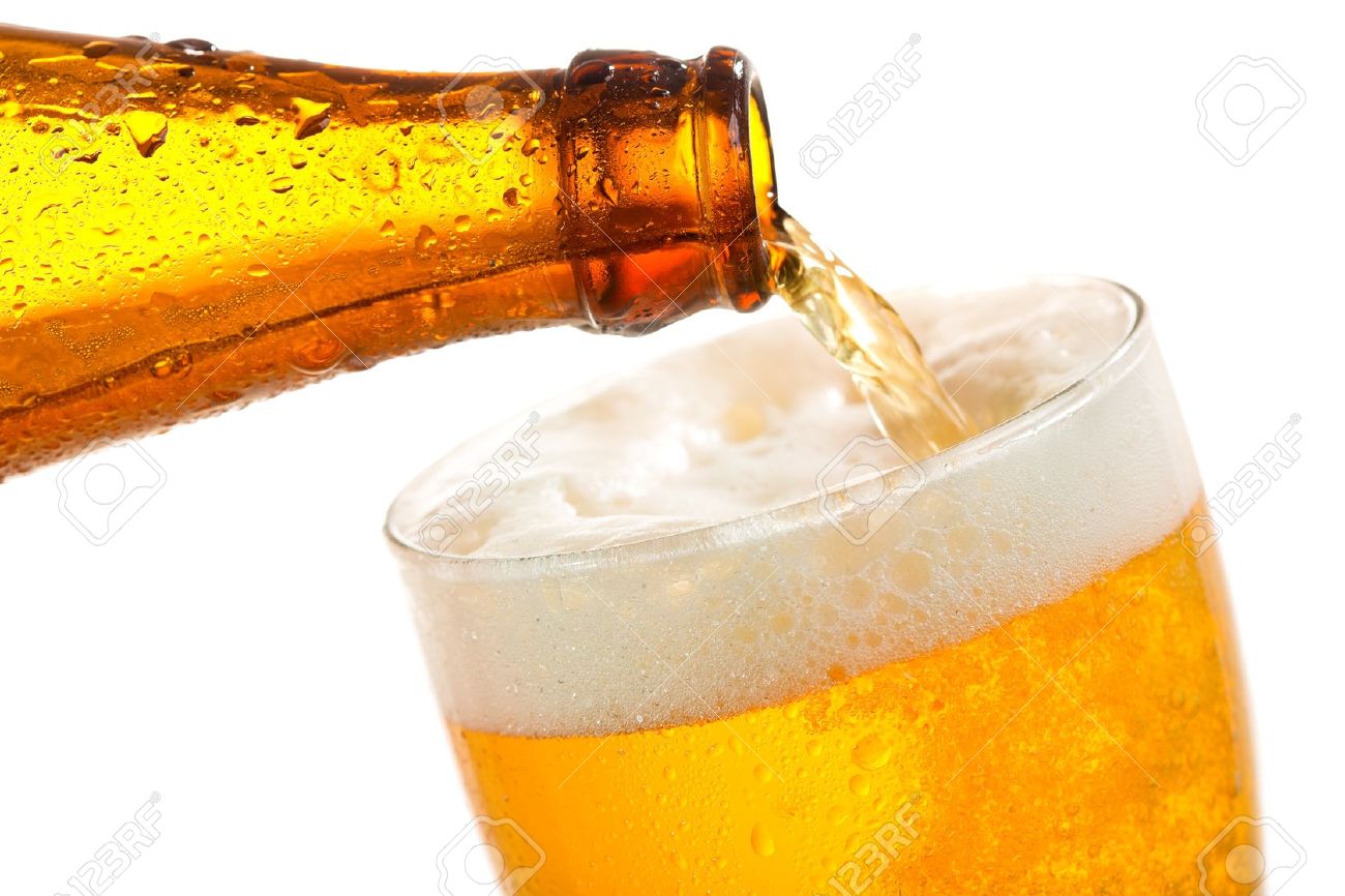 beer pouring into glass on a white background stock photo picture