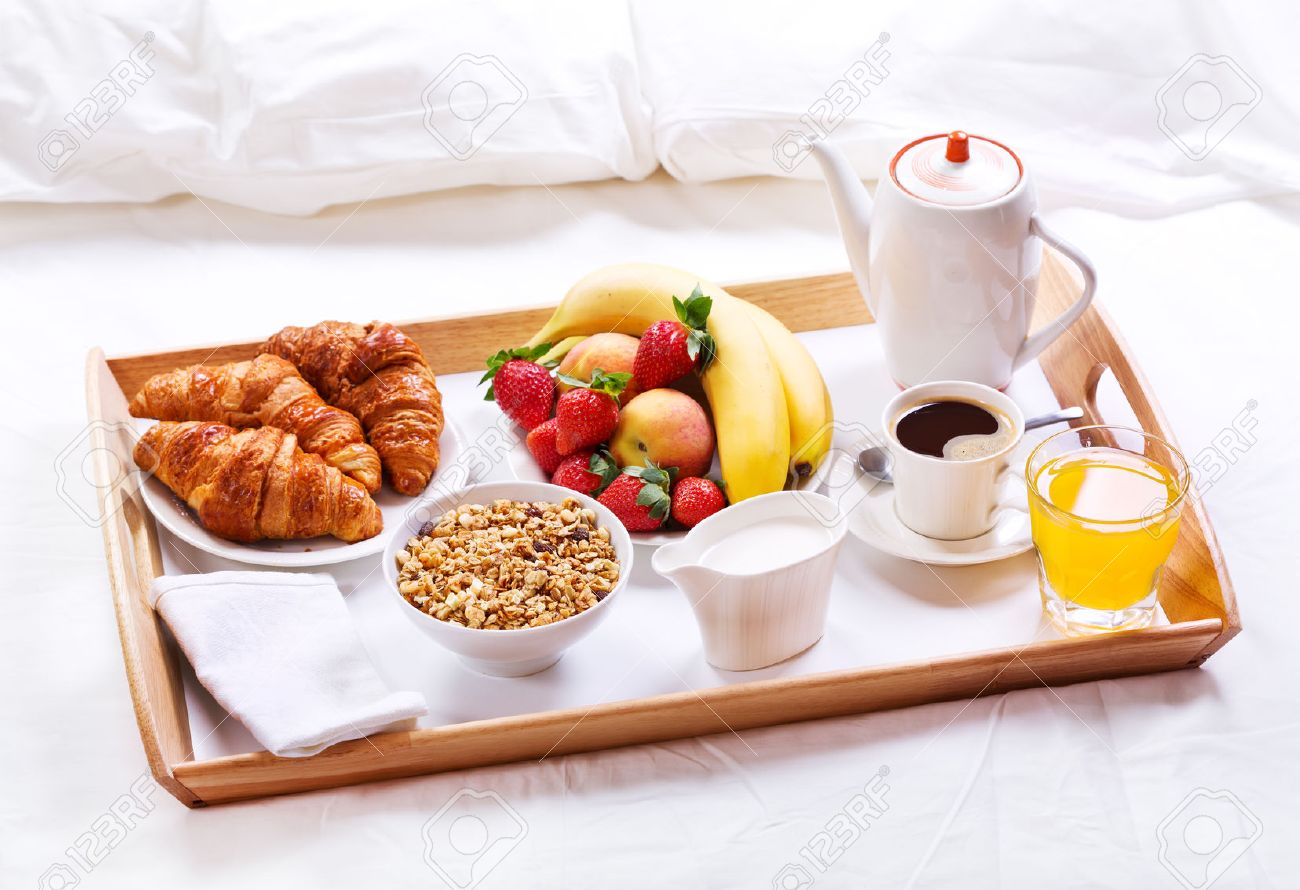 40979480-breakfast-in-bed-tray-with-coffee-croissants-cereals-and-fruits-Stock-Photo.jpg