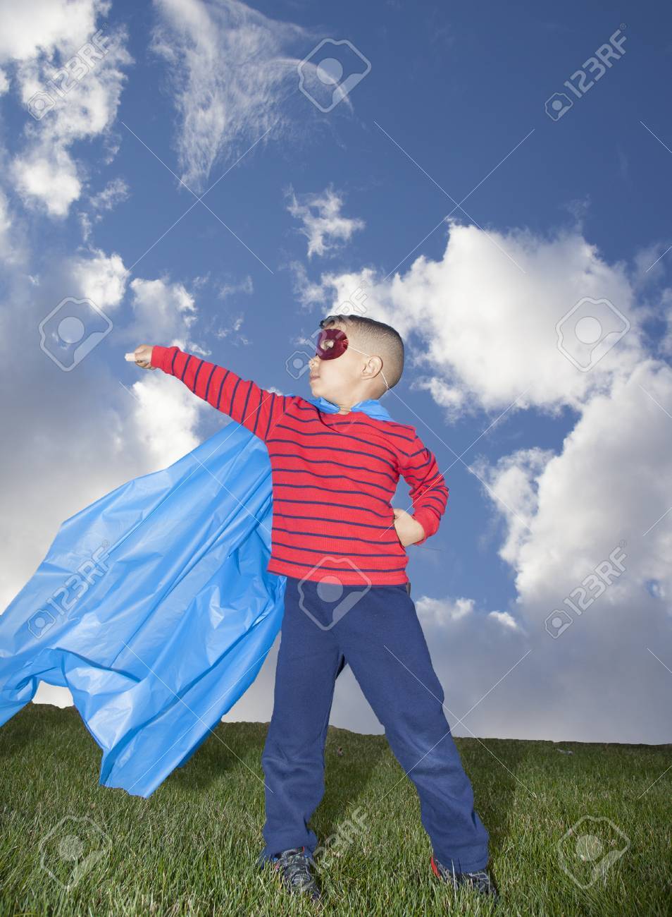 little boy superhero against blue sky - 39761882 little boy superhero against blue sky - 39761882