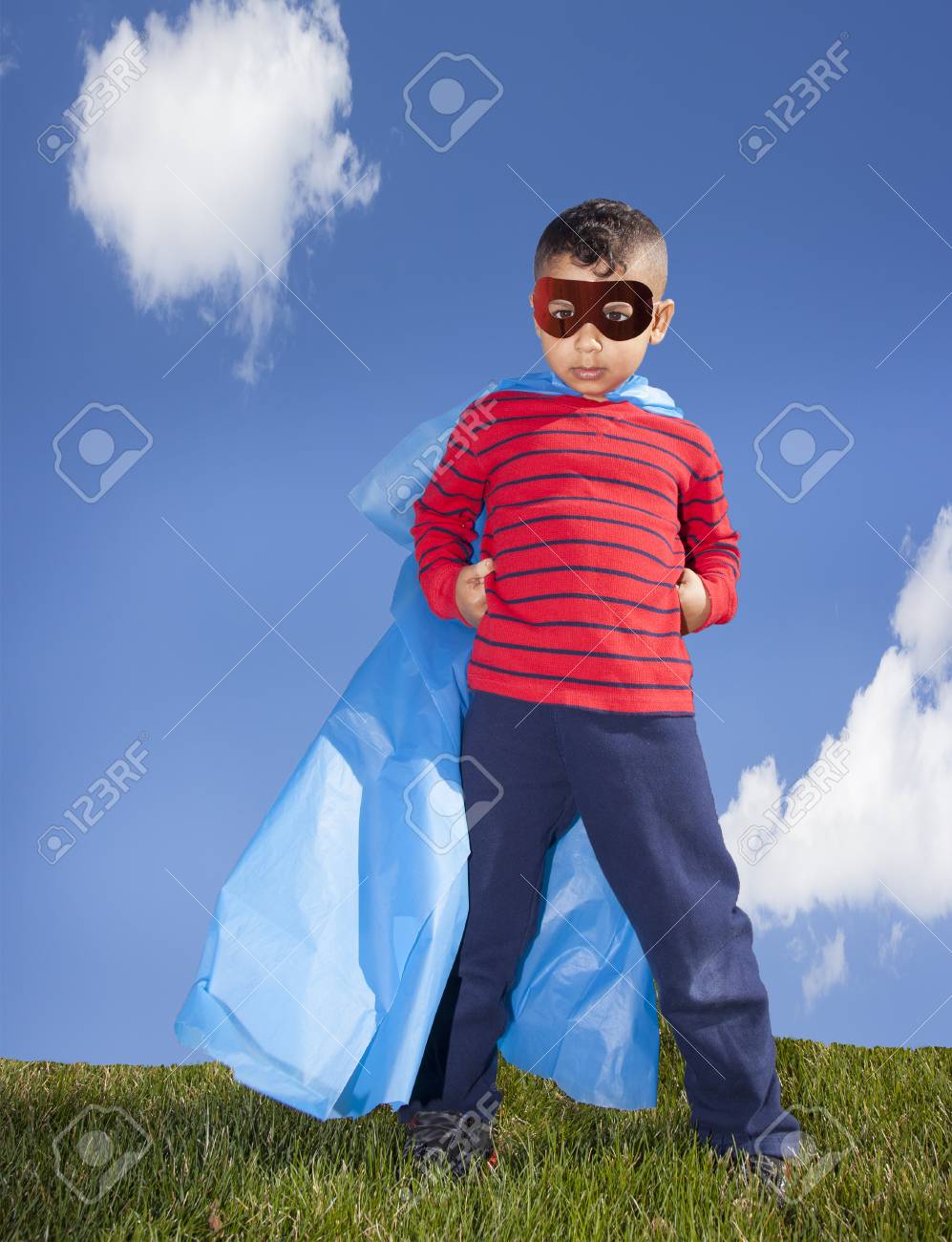 little boy superhero against blue sky - 39762084 little boy superhero against blue sky - 39762084