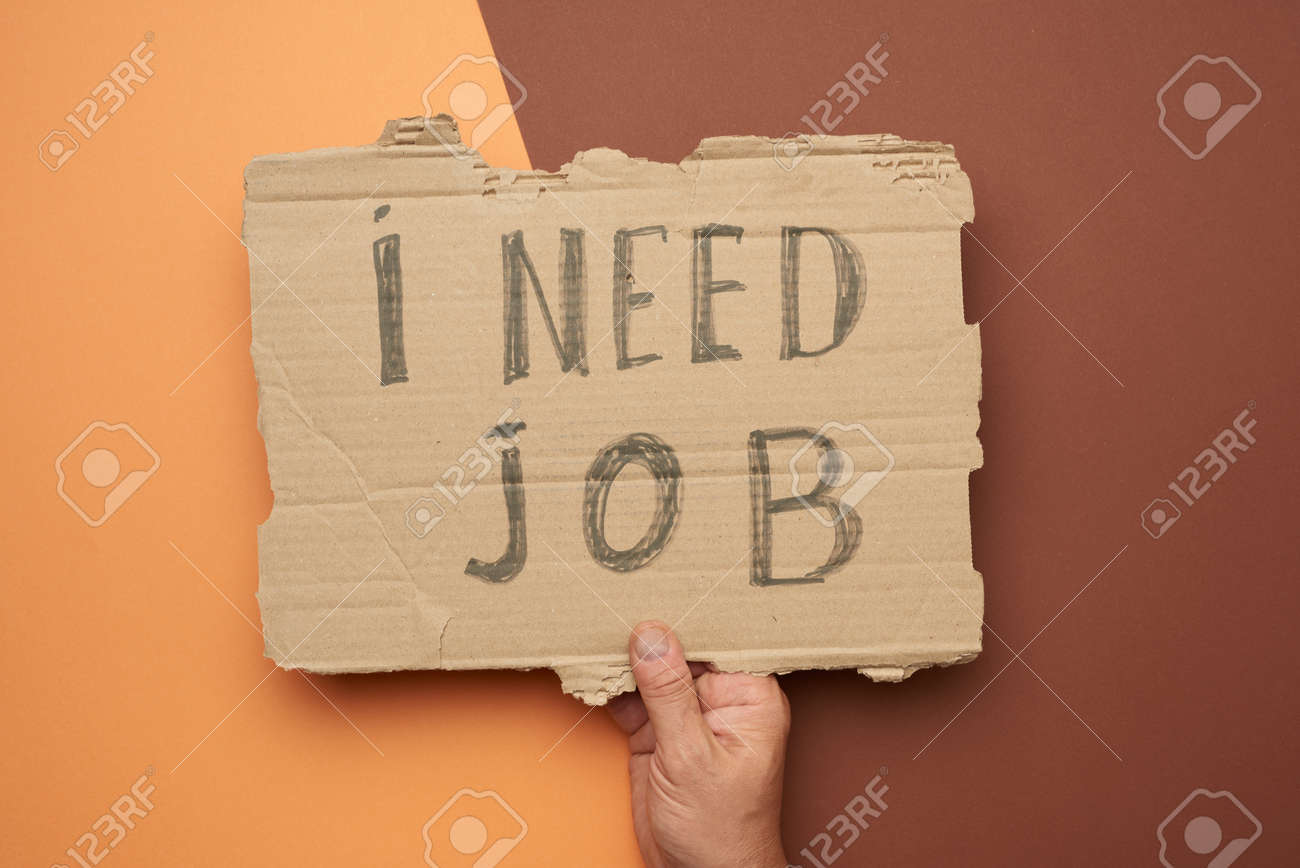 Piece Of Paper With The Inscription I Need Job, Concept Of Unemployment  Against The Backdrop Of The Global Crisis, Fired Employee, Hand On A Brown  Background Stock Photo, Picture and Royalty Free