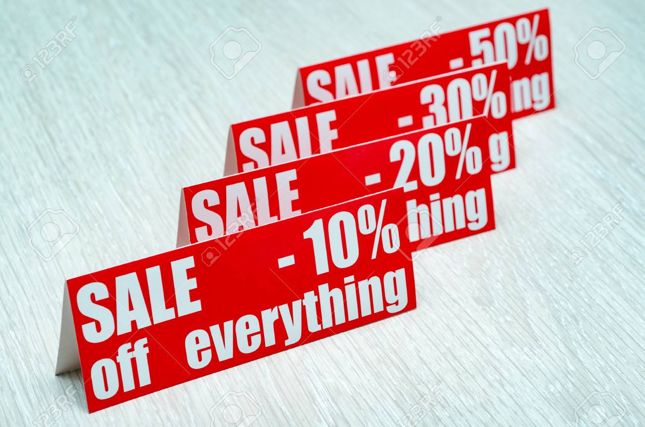 posters sale up to 10 20 30 50 percent on wooden background stock