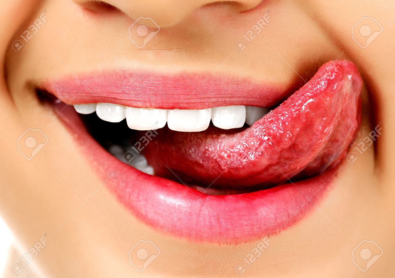 Young Teen Licking Teeth