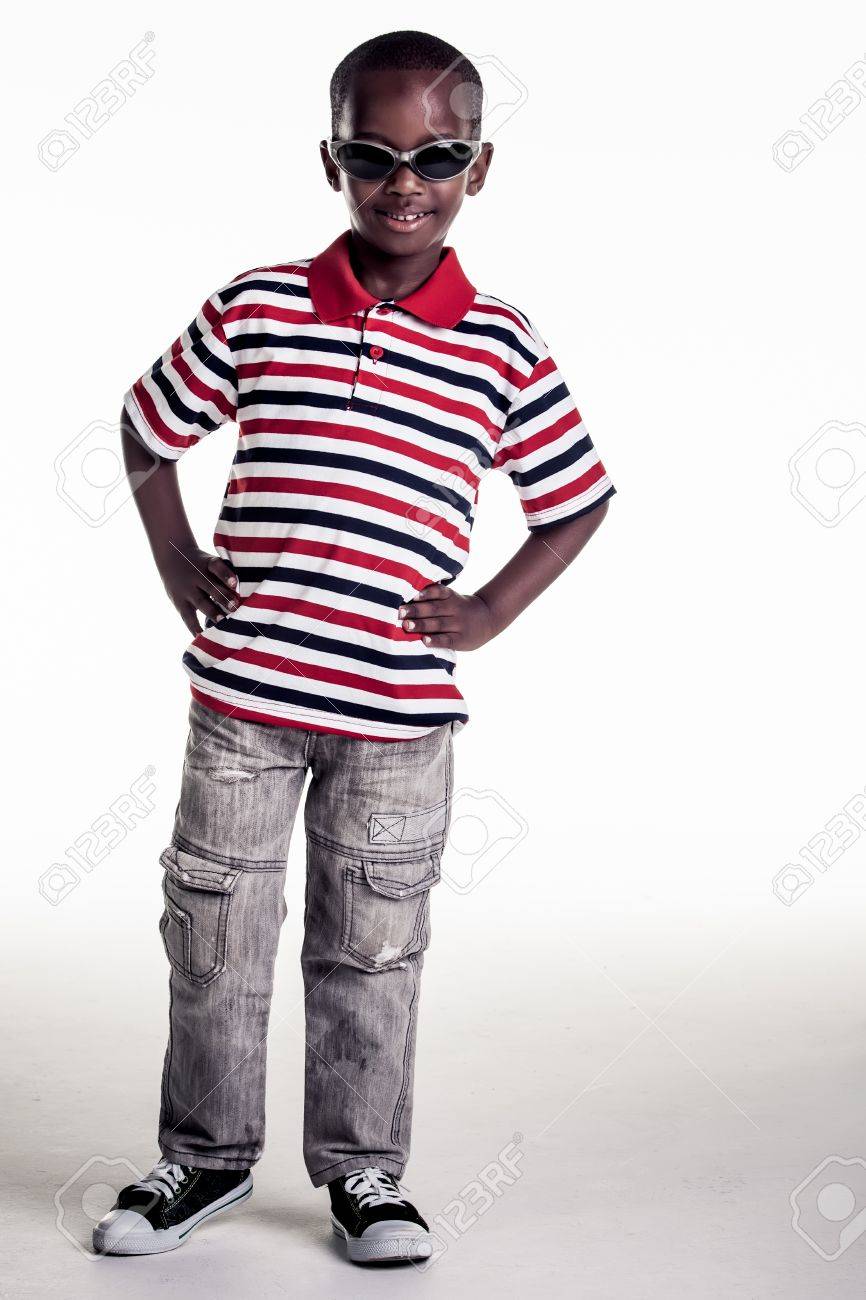 the small boy is dressed in a outfit that gives him a cool