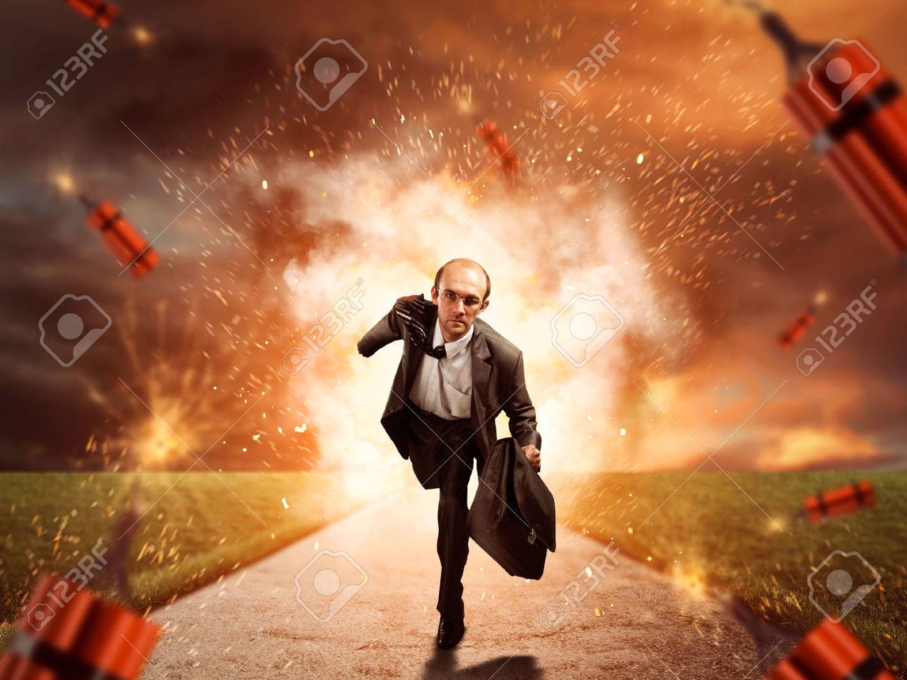 Businessman is running from dynamite exploding on the road - 46391543 Businessman is running from dynamite exploding on the road - 46391543
