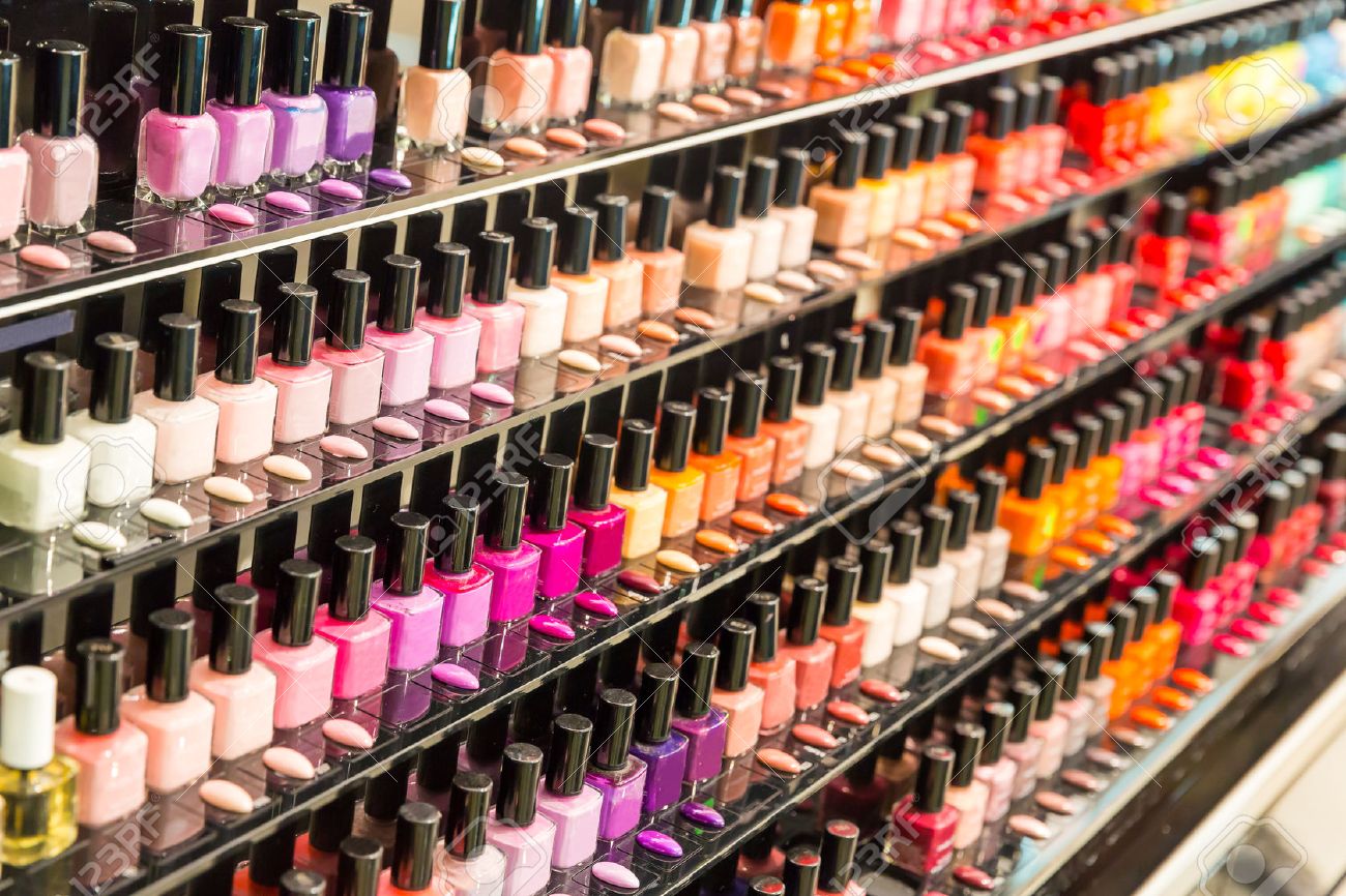 Set of different nail varnishes on shelves in cosmetic store - 46391619 Set of different nail varnishes on shelves in cosmetic store - 46391619