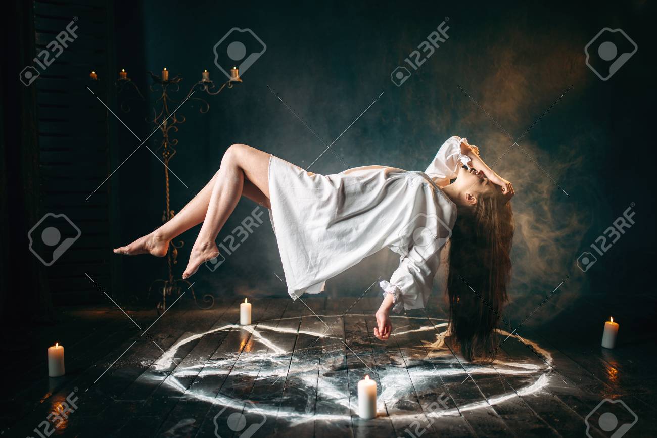 Woman in white shirt flying over pentagram circle - 99438112 Woman in white shirt flying over pentagram circle - 99438112