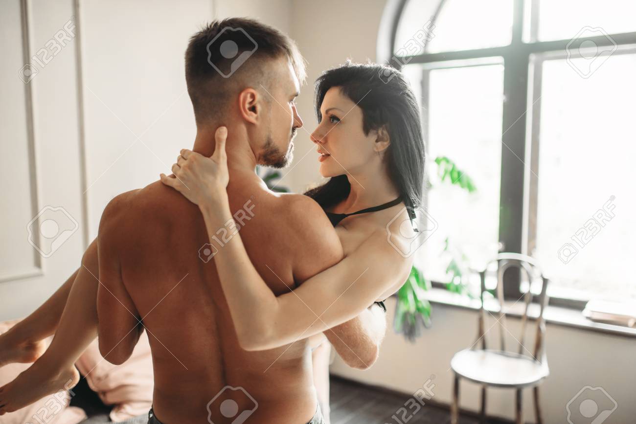 Naked Man Holding Woman In His Arms, Erotica. Erotic Scene, Sexual  Relationship Of Love Couple Stock Photo, Picture and Royalty Free Image.  Image 105288160.