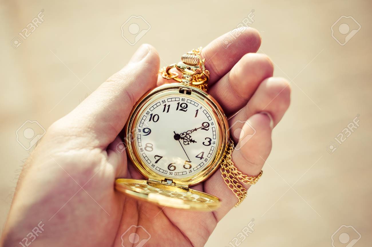 pocket watch in hand