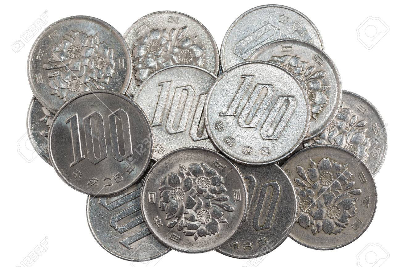 pile of 100 yen coins japanese money close up isolated on white